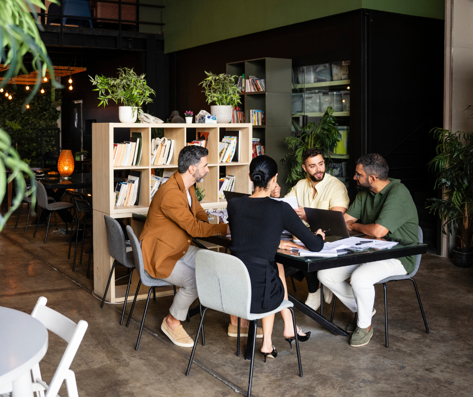 4 Colleagues collaborating around a table