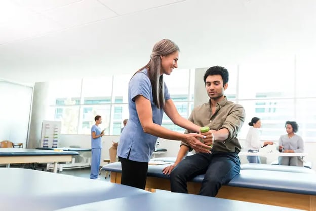 A man is having an occupational health examination with a healthcare professional