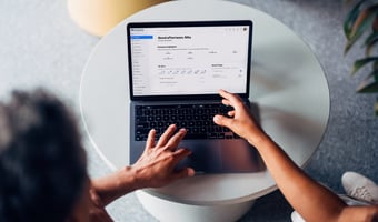 A laptop displaying Breathe - the all-in-one HR software for SMEs with up to 250 employees, with features like absence management, holiday tracking, performance management, reporting, training, recruitment, health and safety, expenses, rota management and more. 