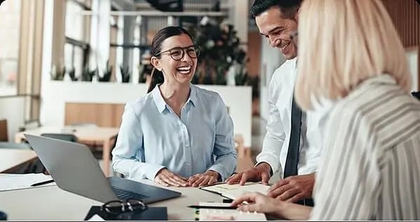 Happy lady laughing with her colleagues-min