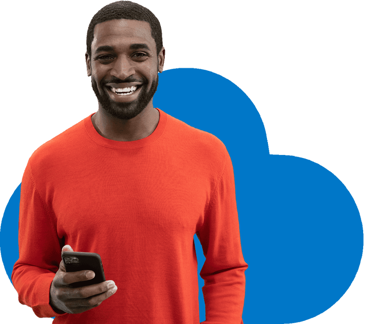 January_campaign_homepage_smiling_man_looking_at_the_camera_holding_phone