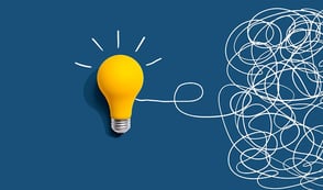 An abstract image is shown against a blue background, depicting a yellow lightbulb attached to a long line of white string that's all tangled up at the right of the screen.