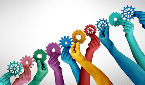 Arms and hands raised, in different colours, holding up cogs in a low to high diagonal line 