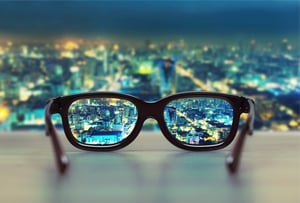 Glasses overlooking city skyline