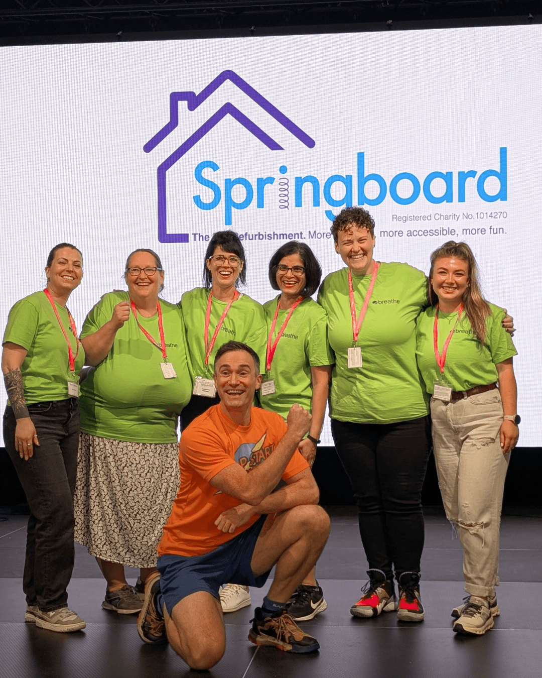 Breathe volunteers posing with Jump Start Jim at a Springboard charity event.