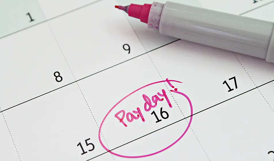 A calendar with a pink circle drawn around the number 16. Within the pink circle it says "payday!".