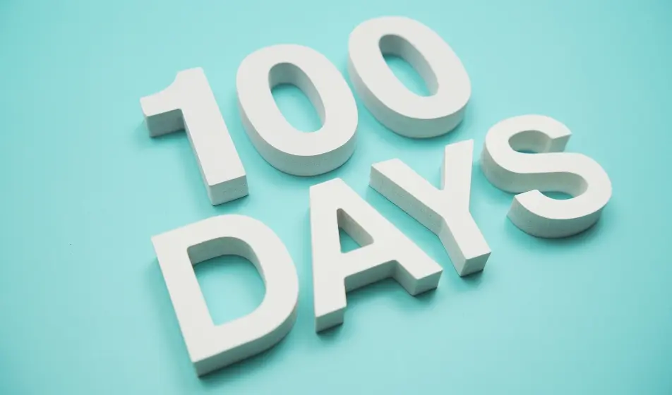 Light blue background with 100 days overlaid in writing