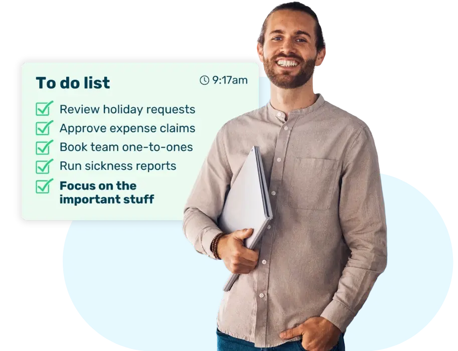 Male HR manager with laptop under his arm smiling as he has completed his HR admin to-do list by 9:17am by using Breathe's HR dashboard