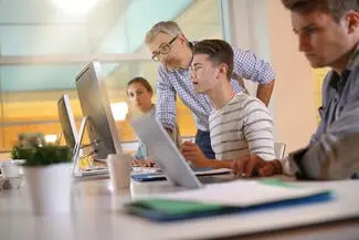 apprentice_student_teacher_desk_officeshutterstock_1034507155 (1)