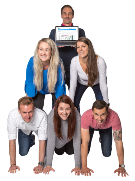 Six members of team Breathe are balancing on top of each other to form a pyramid. Three members are at the bottom, two are in the middle and one is at the top holding a laptop.