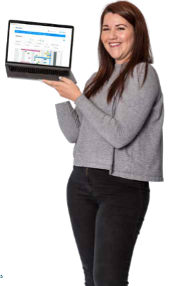 A member of team Breathe is standing against a white background and holding a laptop. On the laptop, there is a display of Breathe's calendar feature.