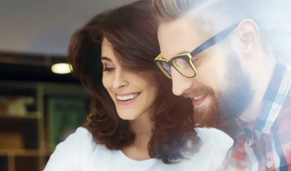 man and woman smiling